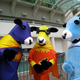Illustration for article titled Free hand jobs and superhero cows: Comic Con Badvertising!